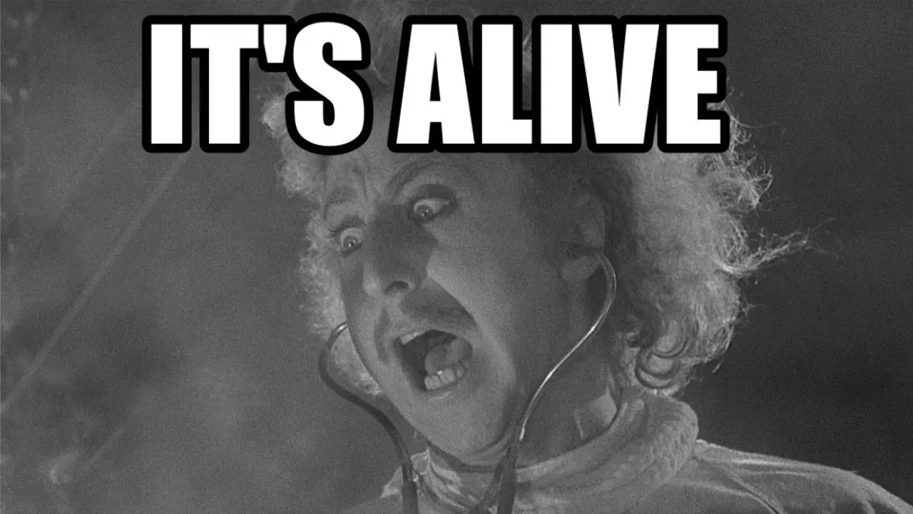 An image from the movie Frankenstein, with caption 'it's alive!'