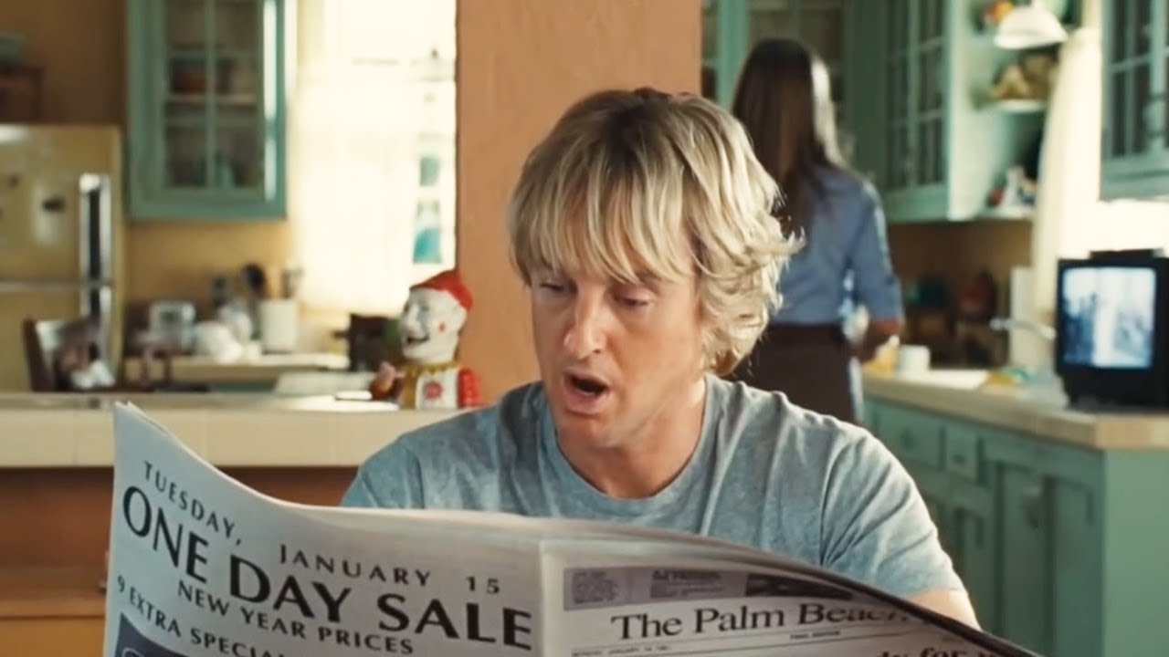 Owen Wilson reading a newspaper