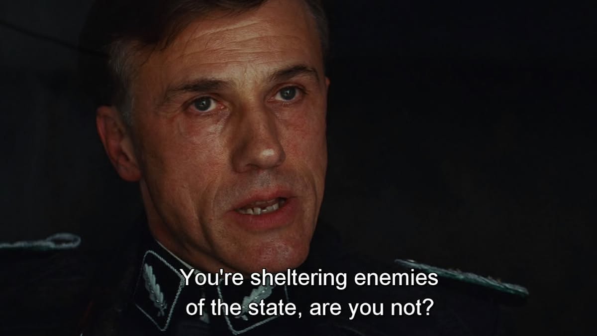 Colonel Hans Landa with the quote 'you're sheltering enemies of the state, are you not?' from Inglourious Basterds