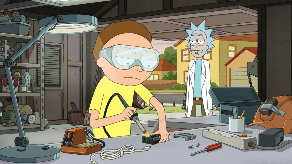 Morty soldering while Rick watches from the garage door