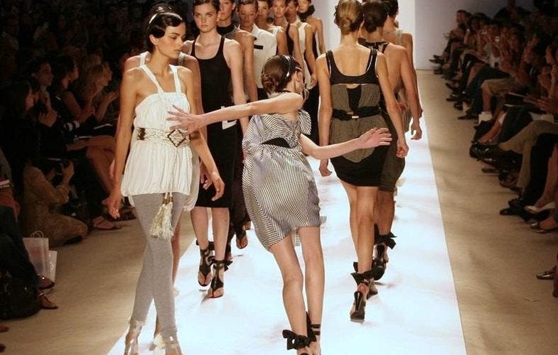 A model stumbling on a platform