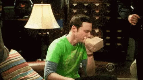 Sheldon from The Big Bang Theory breathing into a bag